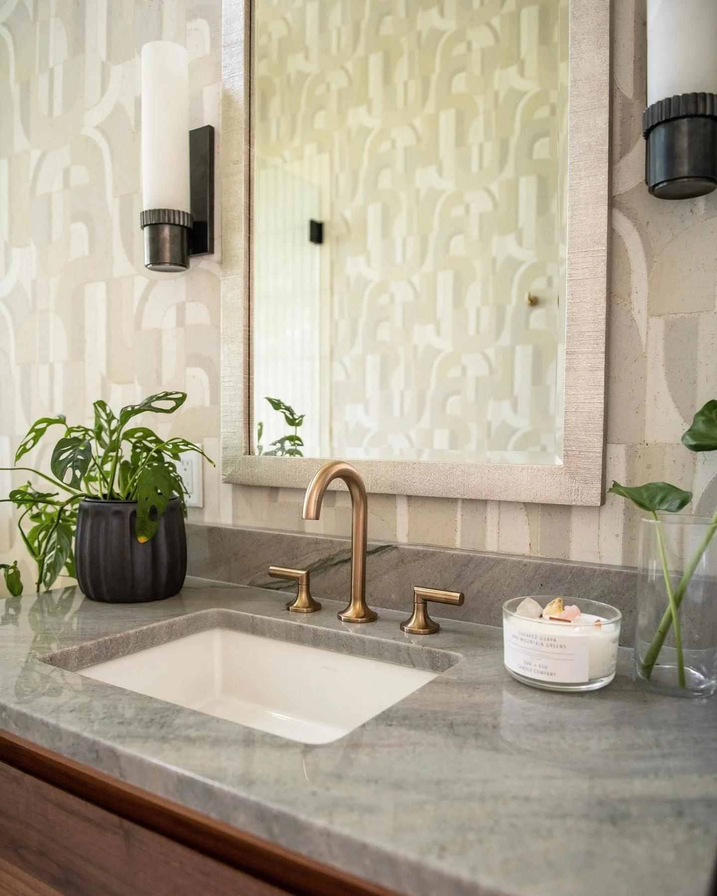 Bath - grey marble counter tops with gold faucet