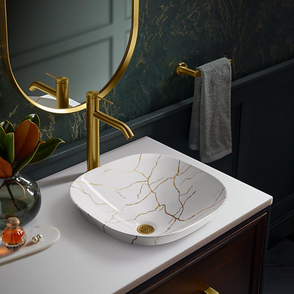 gold sink with gold marble image