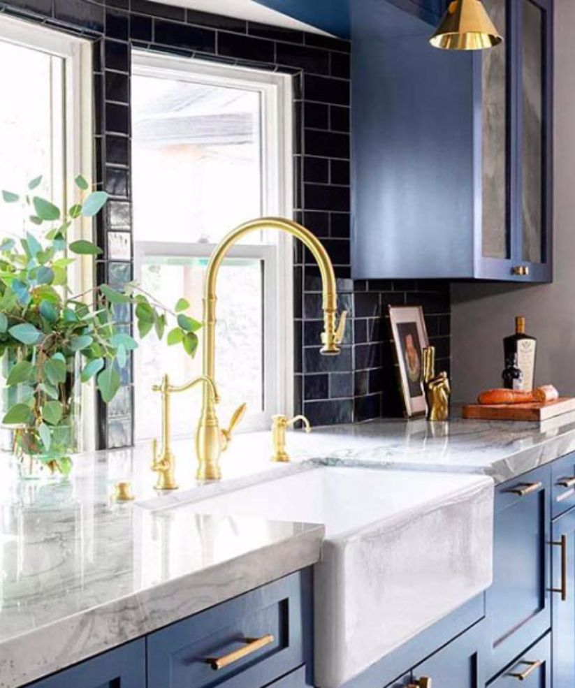 navy kitchen with elegant gold faucet image
